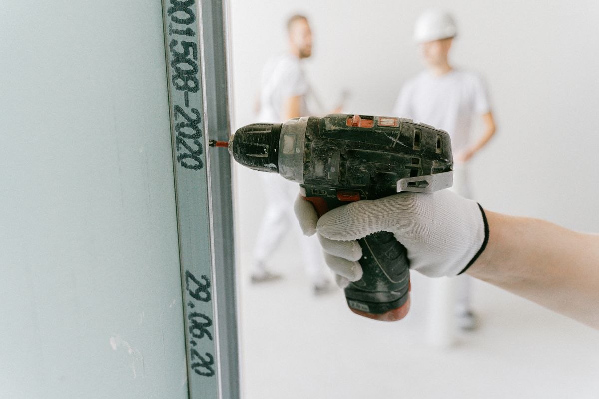 Installing drywall on a job site